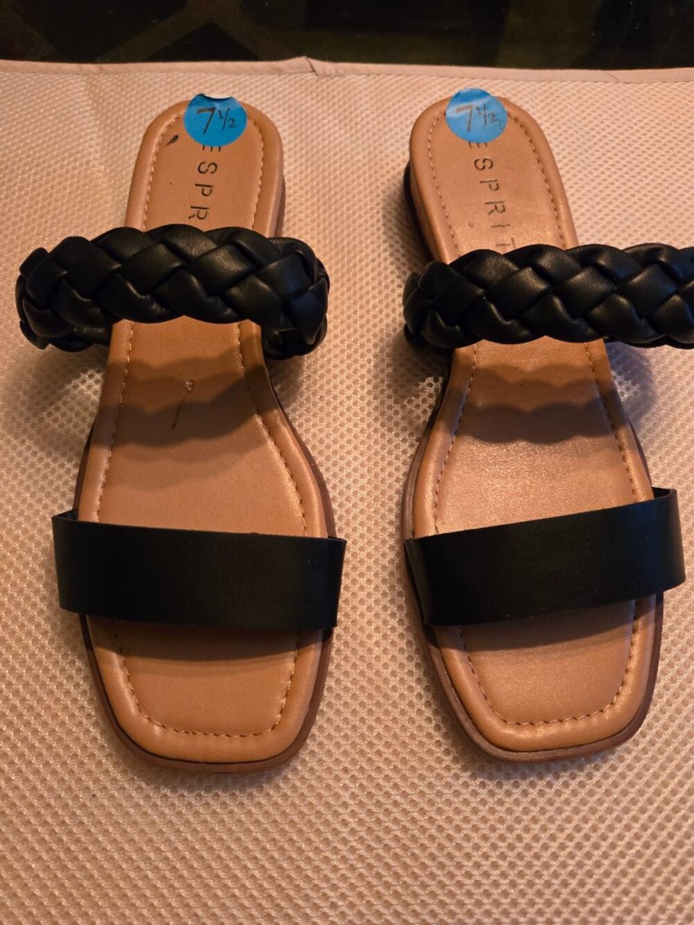 Esprit 7.5 black slide with braided strap across foot